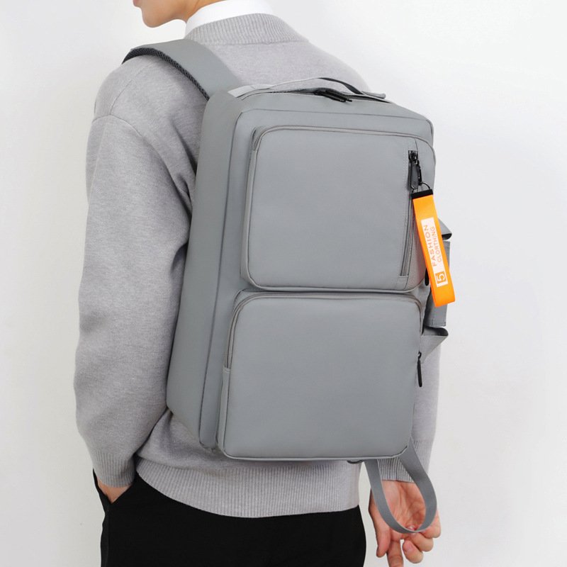 Multifunctional large capacity laptop backpack with USB port in gray and black.