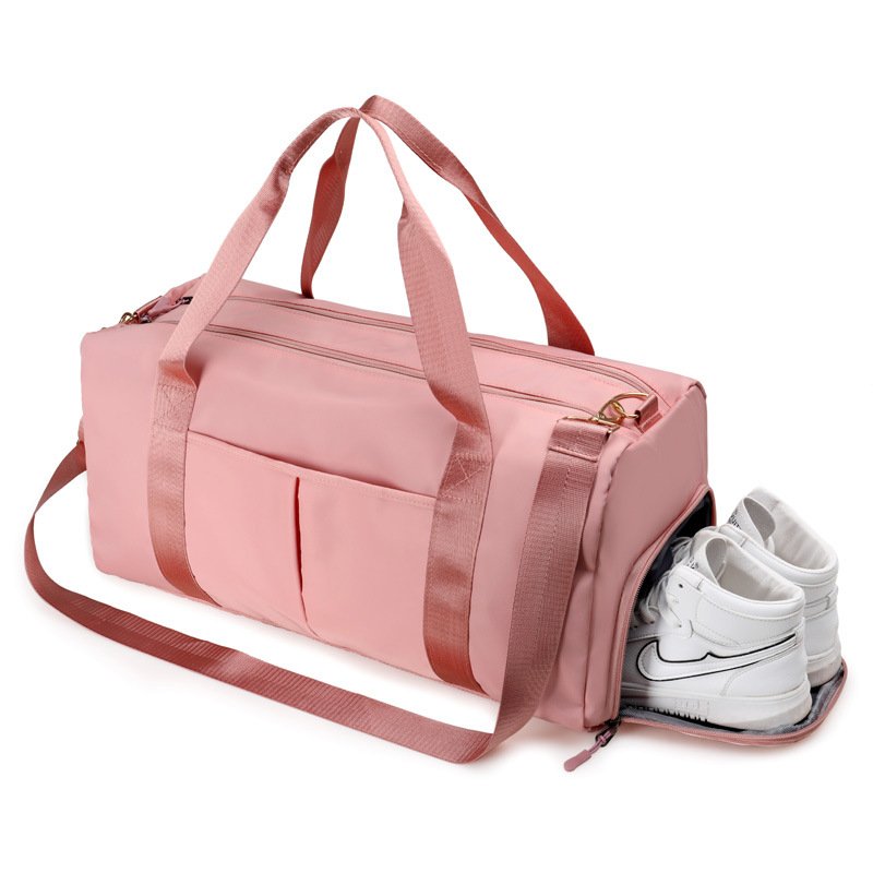 Travel duffel bag with zipper opening, soft handle, single strap, and multiple pockets